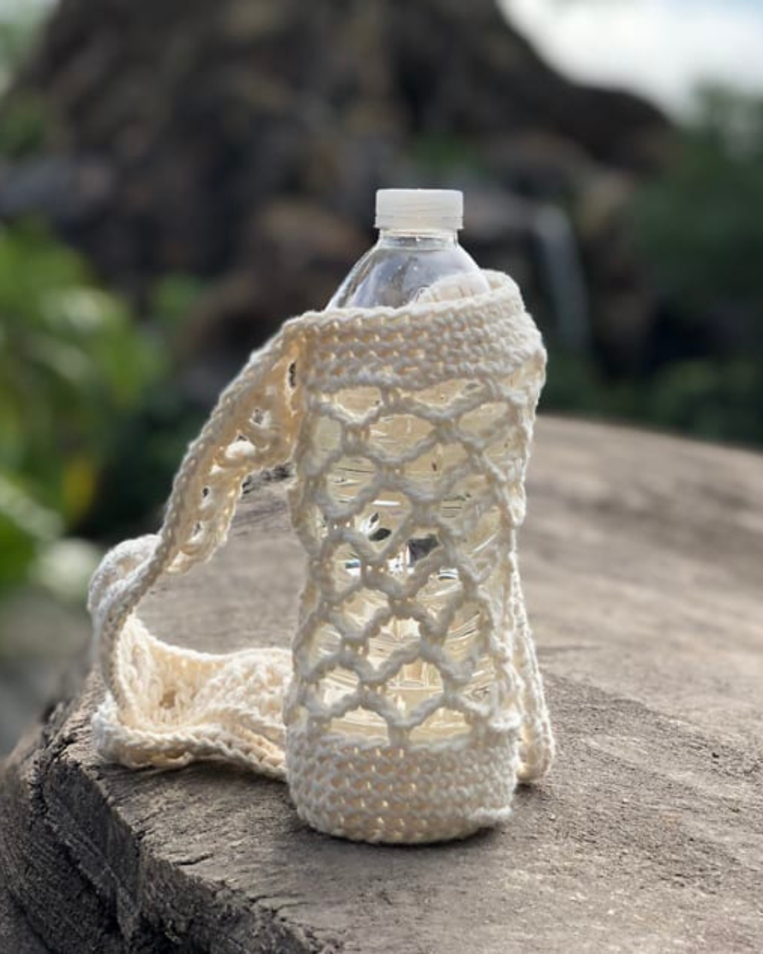 white crochet water bottle holder with strap